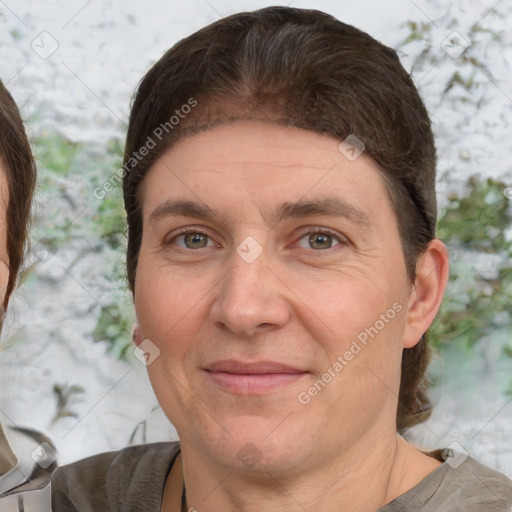 Joyful white adult female with short  brown hair and brown eyes