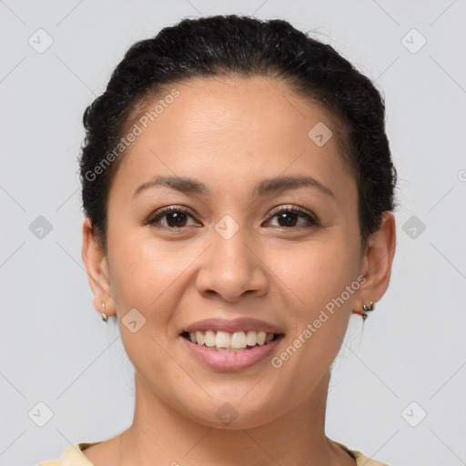 Joyful latino young-adult female with short  brown hair and brown eyes