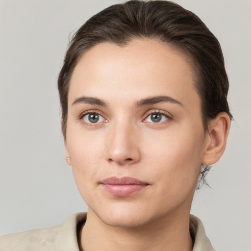 Neutral white young-adult female with short  brown hair and brown eyes