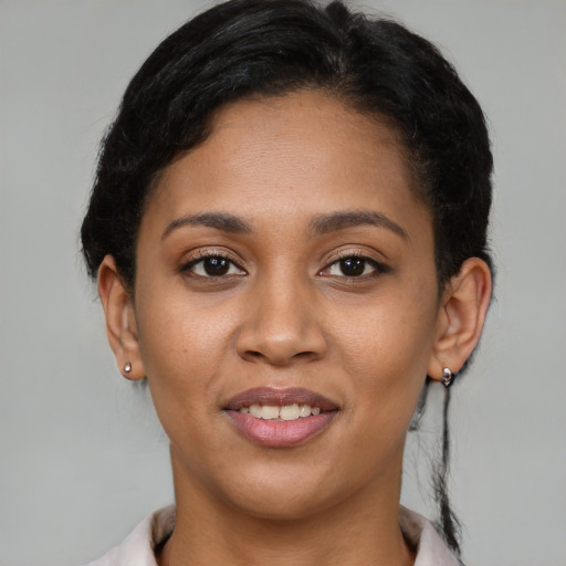 Joyful latino young-adult female with short  brown hair and brown eyes