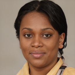 Joyful black young-adult female with medium  brown hair and brown eyes