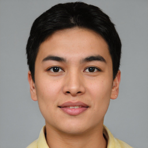 Joyful asian young-adult male with short  brown hair and brown eyes