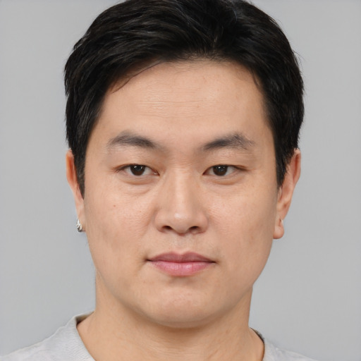Neutral asian young-adult male with short  brown hair and brown eyes