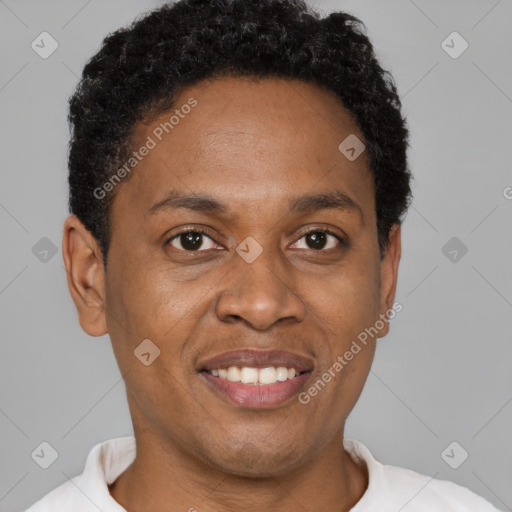 Joyful black young-adult male with short  brown hair and brown eyes