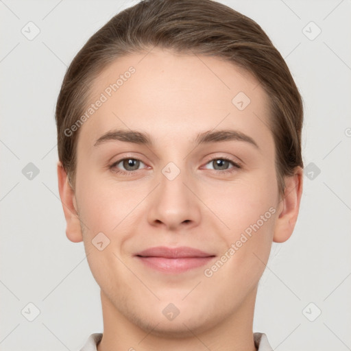 Joyful white young-adult female with short  brown hair and grey eyes