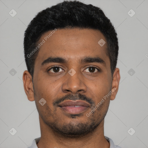 Joyful black young-adult male with short  black hair and brown eyes