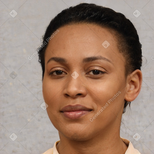 Joyful black young-adult female with short  brown hair and brown eyes