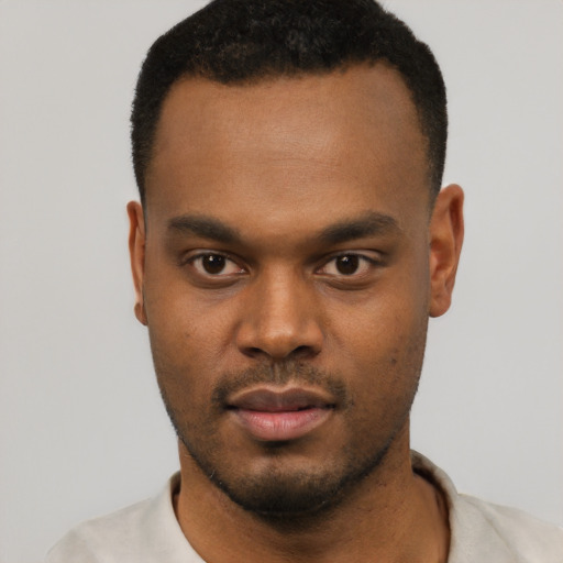 Neutral black young-adult male with short  black hair and brown eyes