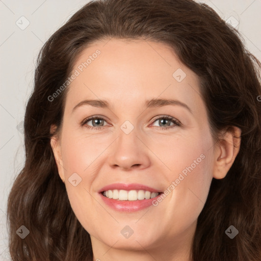 Joyful white adult female with long  brown hair and brown eyes