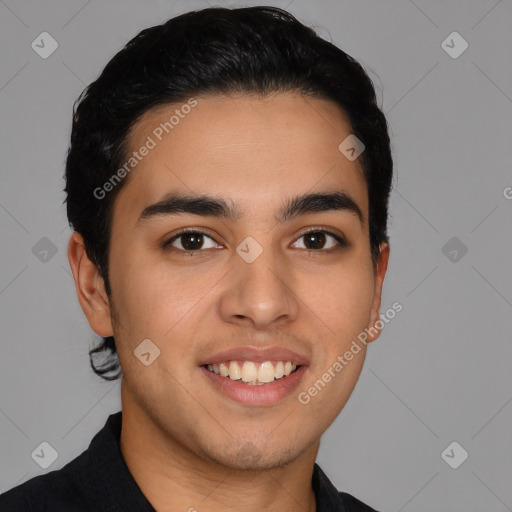 Joyful latino young-adult male with short  black hair and brown eyes