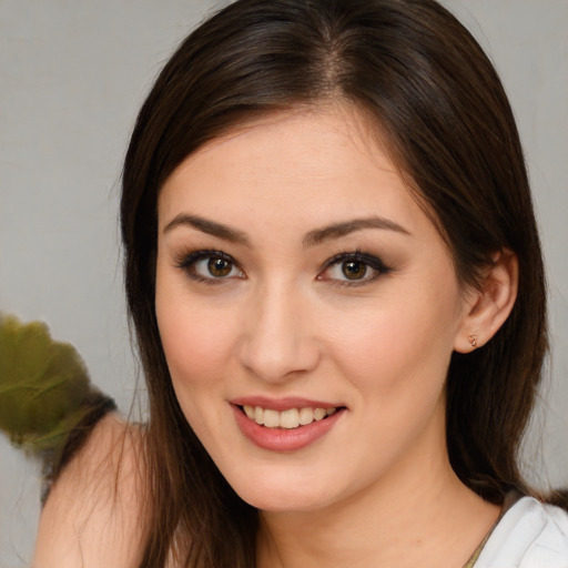 Joyful white young-adult female with medium  brown hair and brown eyes