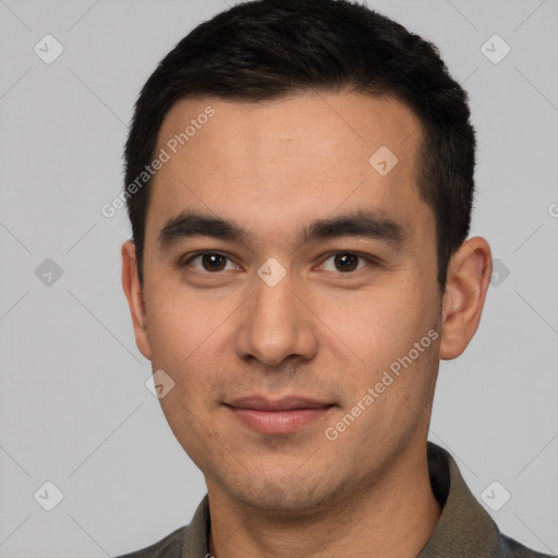 Joyful white young-adult male with short  black hair and brown eyes