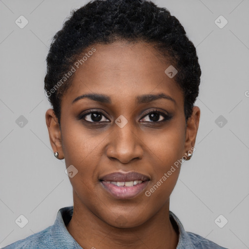 Joyful black young-adult female with short  black hair and brown eyes