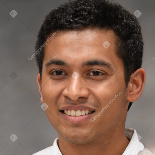 Joyful latino young-adult male with short  brown hair and brown eyes