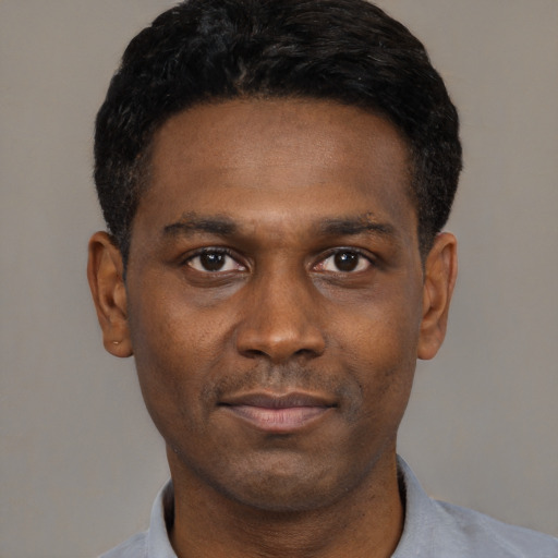 Neutral black young-adult male with short  black hair and brown eyes