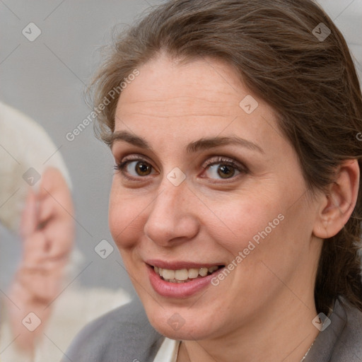 Joyful white adult female with medium  brown hair and brown eyes