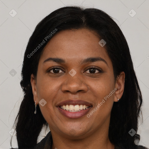 Joyful black young-adult female with long  brown hair and brown eyes