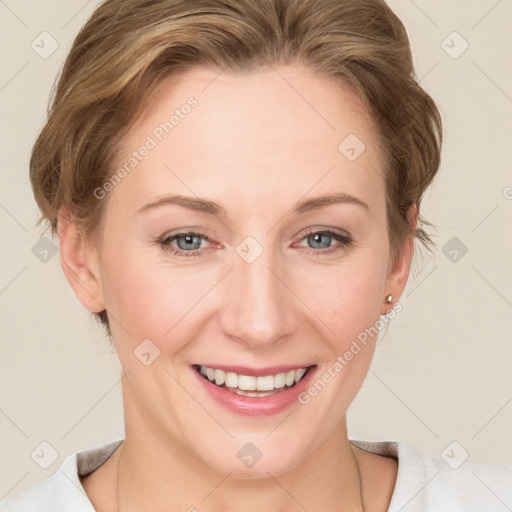 Joyful white young-adult female with medium  brown hair and blue eyes