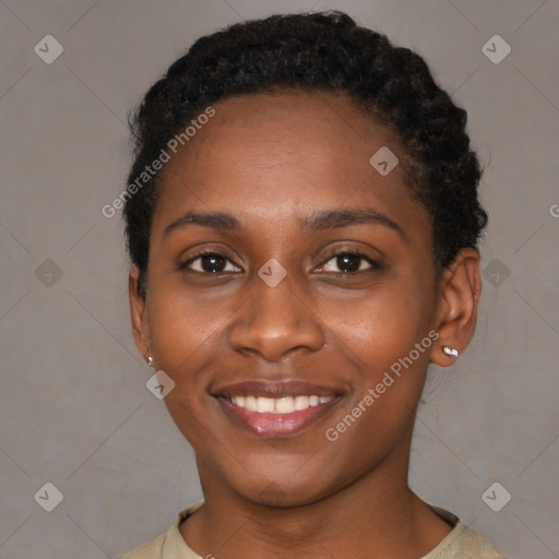 Joyful black young-adult female with short  black hair and brown eyes