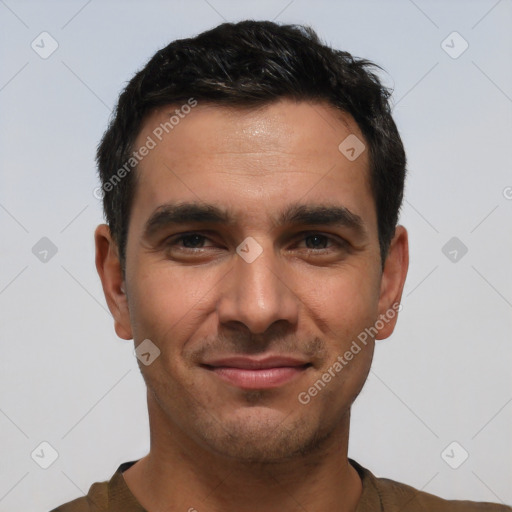 Joyful white young-adult male with short  black hair and brown eyes