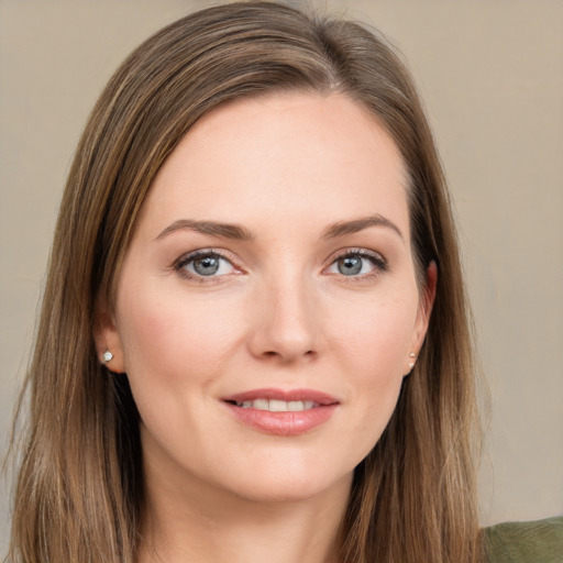 Joyful white young-adult female with long  brown hair and grey eyes