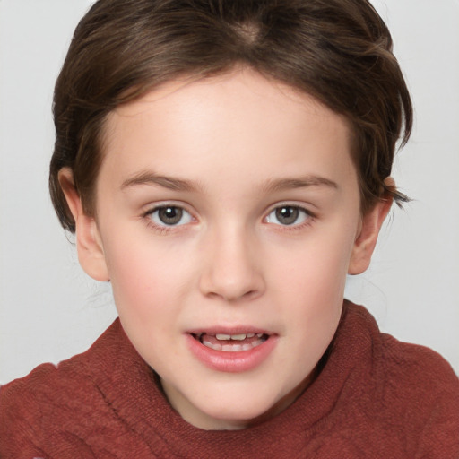 Joyful white child female with short  brown hair and brown eyes