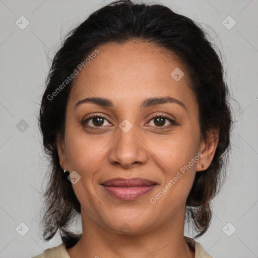 Joyful latino adult female with medium  brown hair and brown eyes