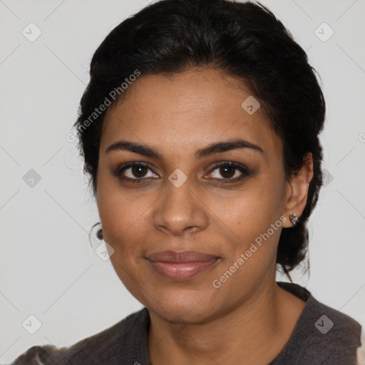 Joyful black young-adult female with medium  black hair and brown eyes