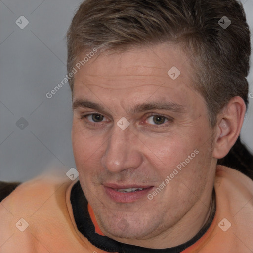 Joyful white adult male with short  brown hair and brown eyes