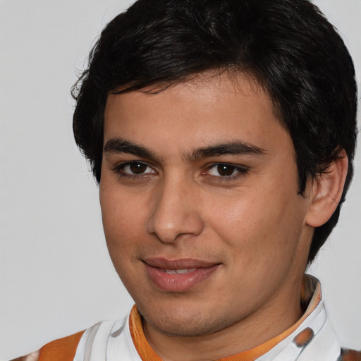 Joyful white young-adult male with medium  brown hair and brown eyes