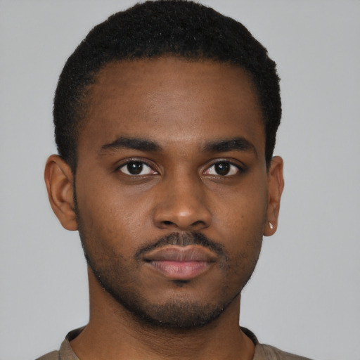 Neutral black young-adult male with short  brown hair and brown eyes
