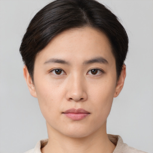Neutral asian young-adult female with short  brown hair and brown eyes