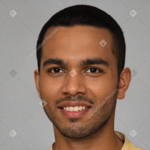 Joyful latino young-adult male with short  brown hair and brown eyes