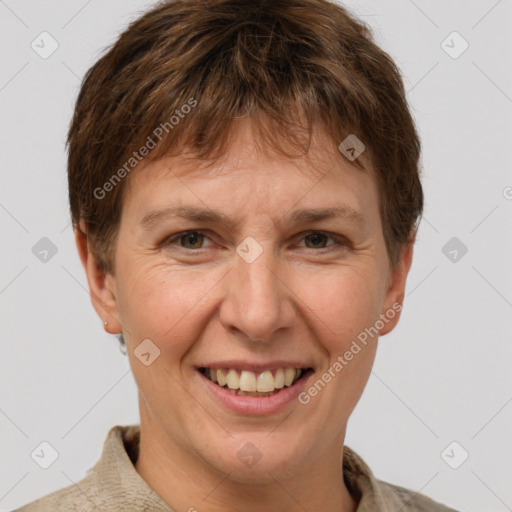 Joyful white adult male with short  brown hair and grey eyes