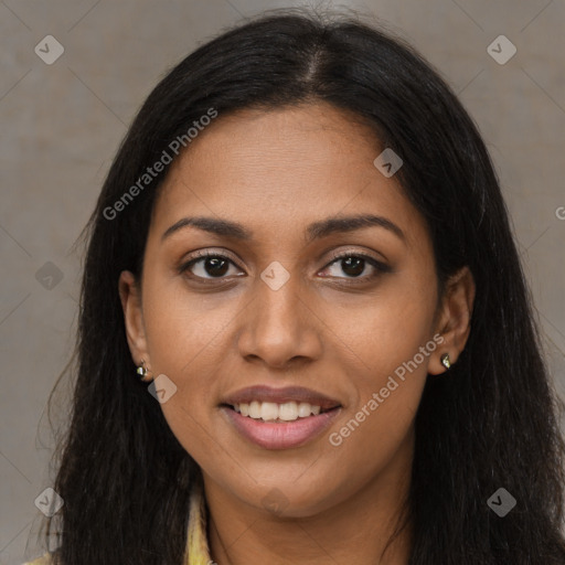 Joyful black young-adult female with long  brown hair and brown eyes