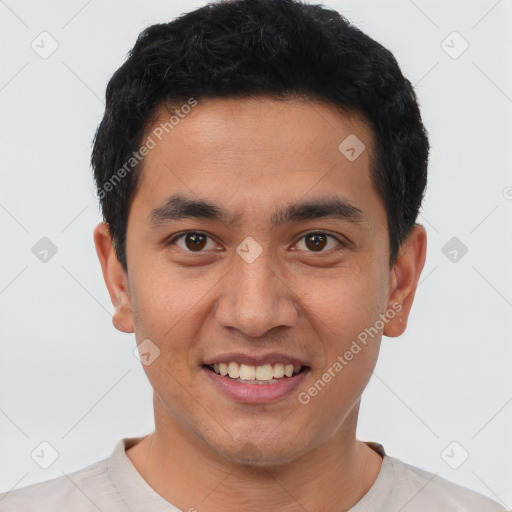 Joyful latino young-adult male with short  black hair and brown eyes