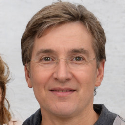 Joyful white adult male with short  brown hair and grey eyes