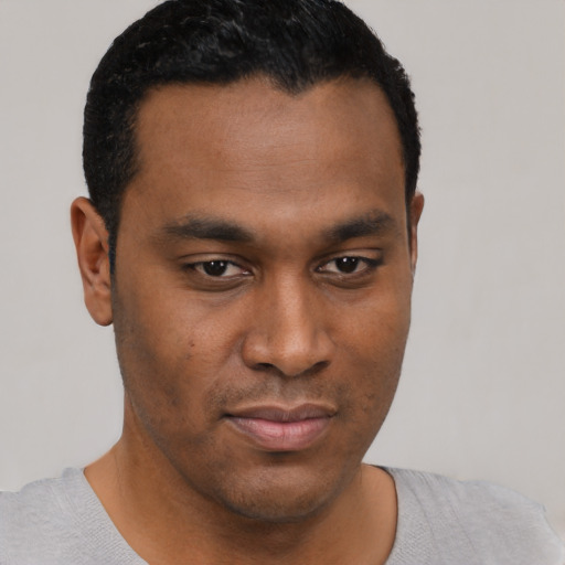 Neutral black young-adult male with short  black hair and brown eyes