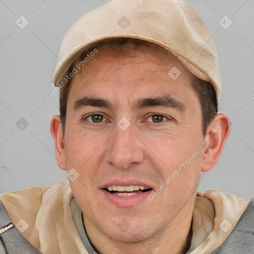 Joyful white adult male with short  brown hair and brown eyes