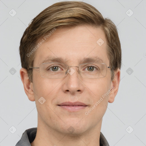 Joyful white adult male with short  brown hair and grey eyes