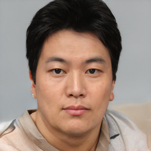 Neutral asian young-adult male with short  brown hair and brown eyes