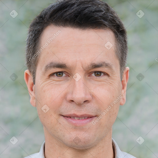 Joyful white adult male with short  brown hair and brown eyes