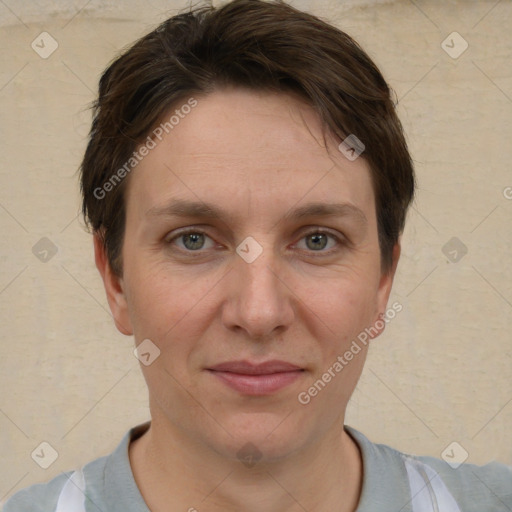 Joyful white adult female with short  brown hair and grey eyes