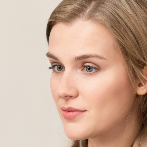 Neutral white young-adult female with long  brown hair and grey eyes