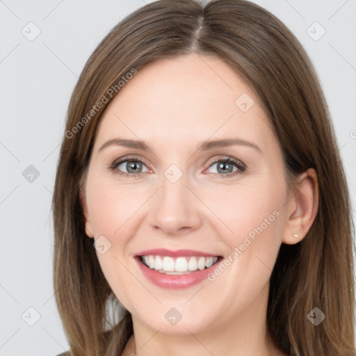 Joyful white young-adult female with long  brown hair and grey eyes