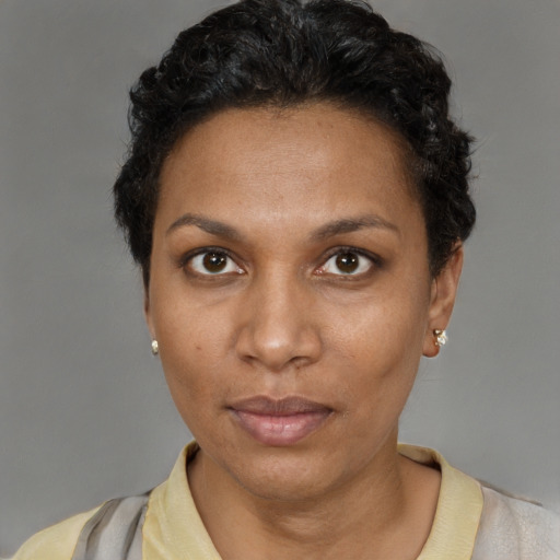 Neutral black adult female with short  black hair and brown eyes