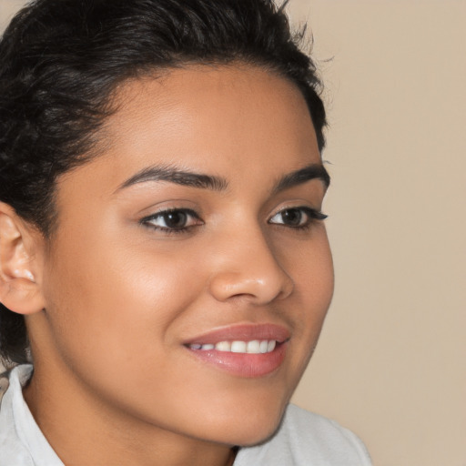 Joyful latino young-adult female with short  brown hair and brown eyes