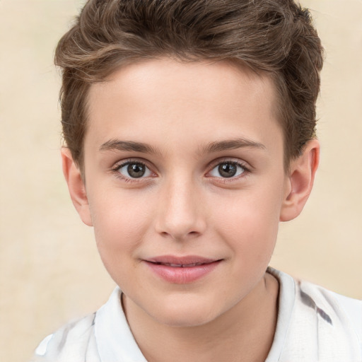 Joyful white child male with short  brown hair and brown eyes