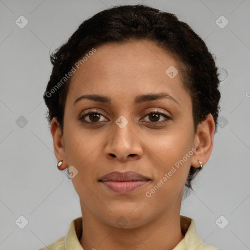 Joyful latino young-adult female with short  brown hair and brown eyes