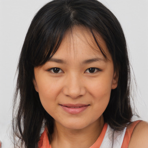 Joyful white young-adult female with medium  brown hair and brown eyes